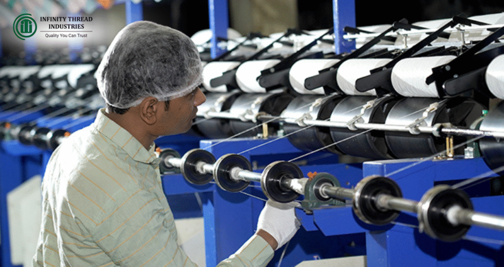 Skilled worker operating advanced machinery at Infinity Thread Industries, one of the top thread manufacturers in India.